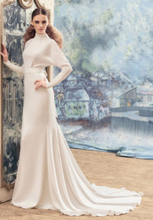 Style #1733La, open back sheath wedding dress with crystals on the high neckline, long sleeves and bow back belt, available in ivory