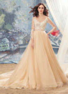 Style #1736Lb, tulle ball gown wedding dress with embroidered lace bodice and long sleeves, available in ivory (with ivory bodice), ivory (with nude bodice), dark ivory (photo)