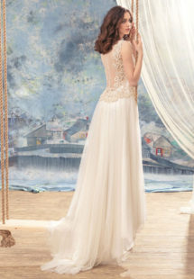 Style #1738L, illusion back A-line wedding dress with lace bodice details and pleated tulle skirt, available in ivory