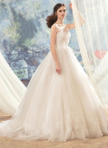 Style #1743L, tulle ball gown wedding dress with illusion lace bodice and hem details, available in ivory