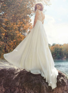 Style #1745L, A-line wedding dress with lace illusion neckline and long sleeves, available in ivory (with ivory bodice), ivory (with nude bodice - photo)