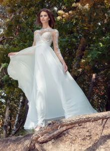 Style #1745L, A-line wedding dress with lace illusion neckline and long sleeves, available in ivory (with ivory bodice), ivory (with nude bodice - photo)