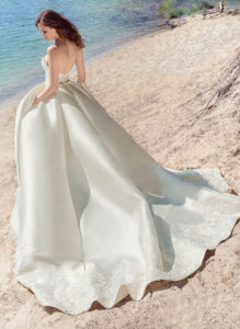 Style #1747L, strapless Mikado ball gown wedding dress with lace details and side pockets, available in white, ivory