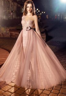 Style #207, short fitted lace dress with illusion 3/4 sleeves and detachable skirt with a rose accent, available in pink-ivory, ivory, black, cool blue