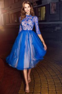 Style #216, tea length A-line cocktail dress with illusion high neckline, 3/4 length sleeves and 3D flower embroidery, available in cornflower-blue, nude and green