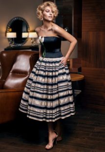 Style #302, strapless tea length cocktail dress with 3-D flower decor on the corset, and horizontal tri-colored striped skirt, available in black