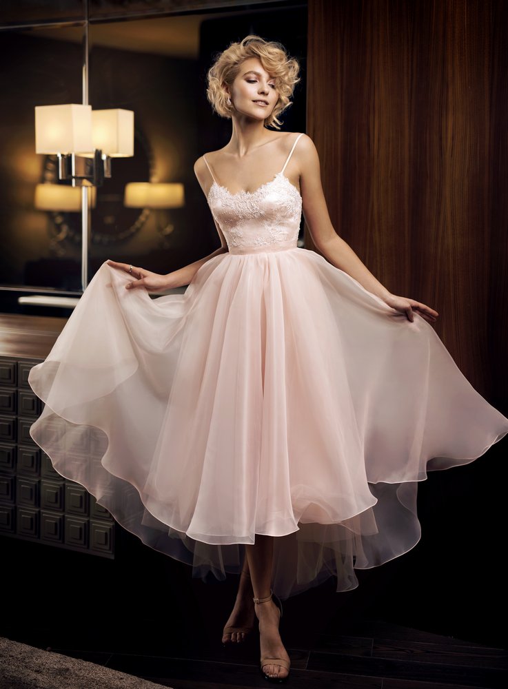 Style #308, tea length dress features fitted lace bodice, spaghetti straps and flowy skirt, available in ivory and salmon