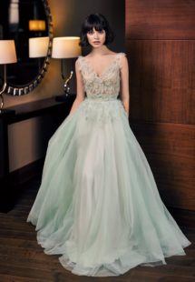 Style #310c, modified a-line evening gown designed with v-neck and leaf embroidery down the skirt, available in ivory and light-green