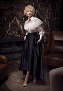 Style #330, black & white skirt combo features lace blouse with ruffles and top underneath, high-low skirt wih pockets, top available in nude, pink, ivory; skirt available in black; blouse available in ivory