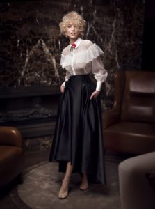 Style #330, black & white skirt combo features lace blouse with ruffles and top underneath, high-low skirt wih pockets, top available in nude, pink, ivory; skirt available in black; blouse available in ivory