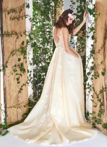 Style #1802L, sleeveless a-line wedding dress features v-neckline, open back, 3-D floral embroidery down the skirt with side pockets, available in ivory and caramel