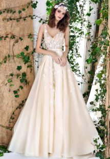 Style #1802L, sleeveless a-line wedding dress features v-neckline, open back, 3-D floral embroidery down the skirt with side pockets, available in ivory and caramel