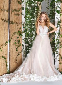 Style #1803L, sleeveless ball gown wedding dress with illusion sweetheart neckline and lace embroidery, available in ivory and powder