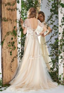 Style #1805L, cape sleeve wedding dress with illusion neckline, open v-back and lace embroidery, available in ivory and caramel