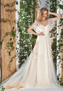 Style #1805L, cape sleeve wedding dress with illusion neckline, open v-back and lace embroidery, available in ivory and caramel