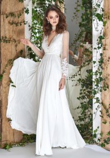 Style #1807L, sheath long sleeve wedding dress features illusion back, deep v-neck and chiffon skirt, available in ivory