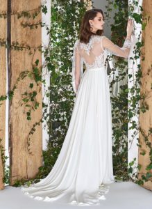 Style #1807L, sheath long sleeve wedding dress features illusion back, deep v-neck and chiffon skirt, available in ivory