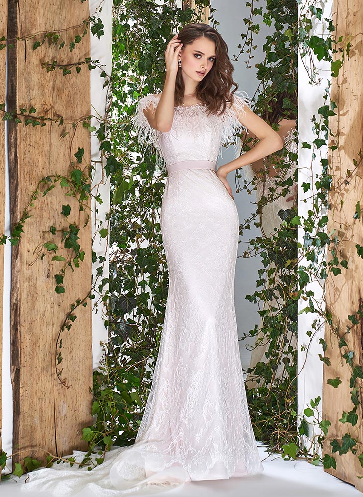 Style #1808L, lace off-the-shoulder wedding dress with feathers at the illusion neckline, available in light pink
