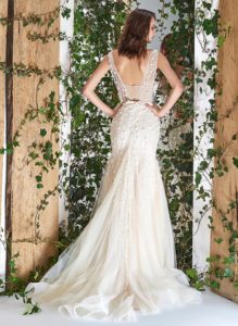 Style #1811L, sleeveless fit and flare wedding dress with deep v neck, 3-D floral embroidery and slit down the skirt, available in ivory and ivory-nude