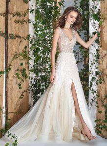 Style #1811L, sleeveless fit and flare wedding dress with deep v neck, 3-D floral embroidery and slit down the skirt, available in ivory and ivory-nude