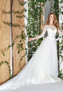 Style #1812LS, three-quartered sleeve ball gown wedding dress, designed with the illusion neckline and lace scalloped hem, available in ivory