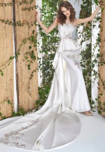 Style #1813L, illusion neckline sheath wedding gown with peplum skirt and lace embroidery, available in ivory