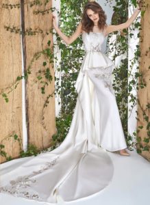Style #1813L, illusion neckline sheath wedding gown with peplum skirt and lace embroidery, available in ivory