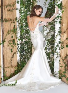 Style #1814L, satin trumpet wedding dress features a sweetheart neckline, lace embroidery down the skirt, crisscross spaghetti straps over the low back, available in ivory