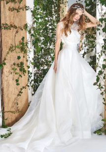 Style #1820L, sleeveless a-line wedding gown features feathers and beading embroidered lace top, a figure-cinching wide waistband with tulle skirt, available in ivory