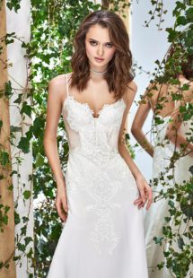 Style #1822L, satin fit and flare wedding dress with sweetheart neckline, spaghetti straps, and lace embroidery down the top, available in cream and ivory