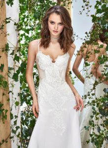 Style #1822L, satin fit and flare wedding dress with sweetheart neckline, spaghetti straps, and lace embroidery down the top, available in cream and ivory