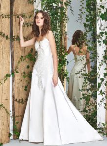 Style #1822L, satin fit and flare wedding dress with sweetheart neckline, spaghetti straps, and lace embroidery down the top, available in cream and ivory