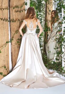 Style #1825L, cap sleeve a-line wedding gown, designed with illusion sweetheart neckline, low back, pockets, and lace embroidery on top, available in cream and ivory