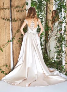 Style #1825L, cap sleeve a-line wedding gown, designed with illusion sweetheart neckline, low back, pockets, and lace embroidery on top, available in cream and ivory