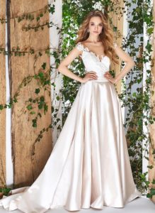 Style #1825L, cap sleeve a-line wedding gown, designed with illusion sweetheart neckline, low back, pockets, and lace embroidery on top, available in cream and ivory