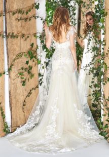 Style #1832L, cap sleeve fit and flare wedding dress features illusion sweetheart neckline, open back, 3D overlay skirt, beading, and floral embroidery, available in ivory and caramel