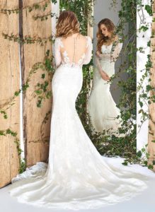 Style #1837L, fit and flare lace wedding dress with long sleeves, illusion neckline, and low back, available in ivory and cream