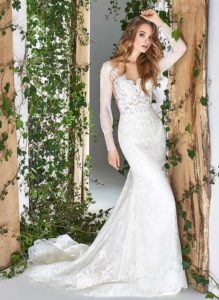 Style #1837L, fit and flare lace wedding dress with long sleeves, illusion neckline, and low back, available in ivory and cream