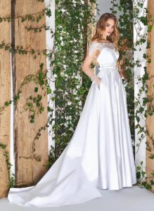Style #1840L, satin a-line wedding dress with illusion neckline, and off the shoulder short sleeve, available in white, cream and ivory