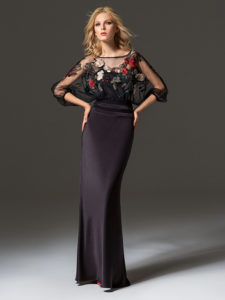 Style #334, fit-and-flare evening gown features flower embroidered illusion top with dolman three-quarter length sleeves, available in black