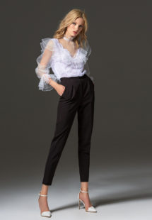 Style #338-3, high collared lace blouse with sheer bishop sleeves and ruffled details, available in white. Style #338-4, mid-rise skinny trousers, available in black, ivory, scarlet, dark blue, blue, pink-ivory, green, grey