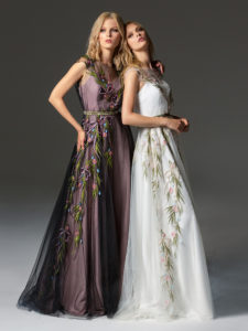 Style #340, cap sleeve maxi dress with an illusion neckline and floral embroidery down the skirt, available in black, ivory, pink-ivory