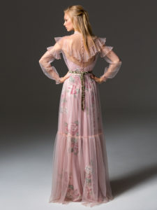 Style #341, long sleeve evening dress features an illusion high neck with ruffled details, and flower embroidered lining dress with the sheer overlay skirt, available in pink-ivory