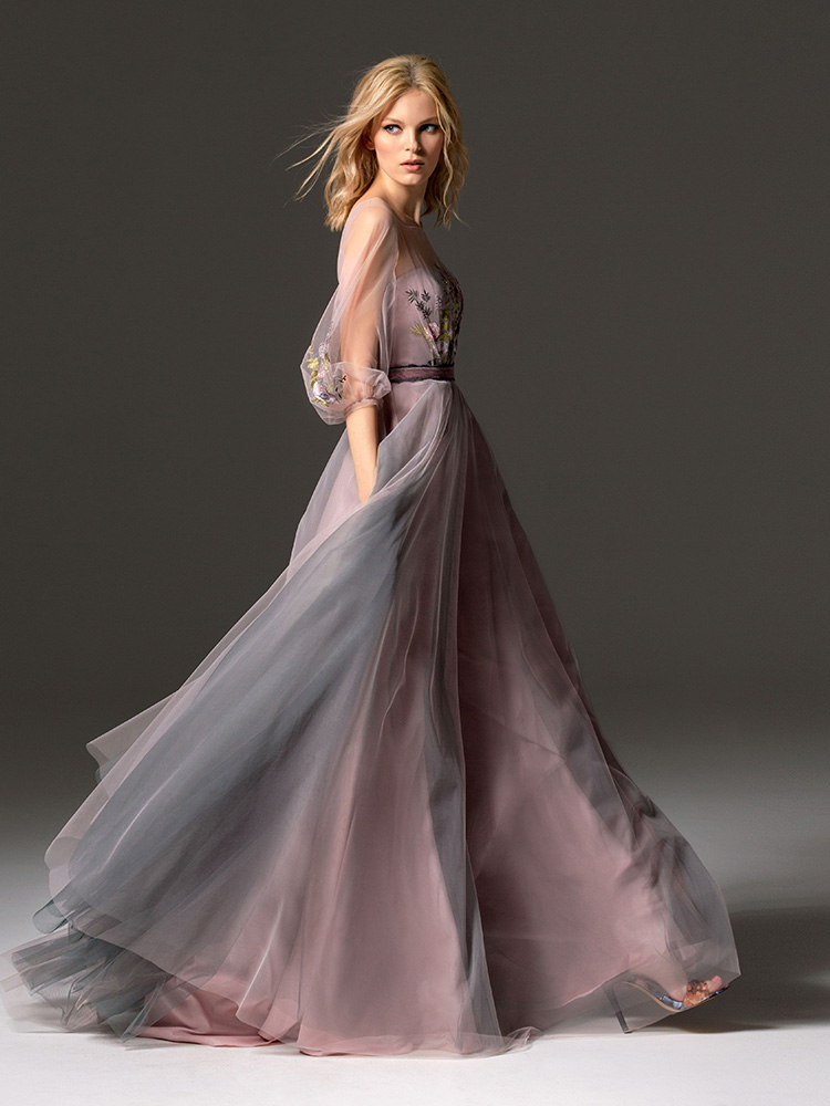 Style #343, long evening gown with an illusion neckline, three-quarter length bishop sleeves, floral embroidery, and velvet belt, available in grey, pink-ivory, ivory