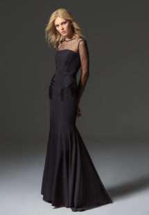 Style #344, fit-and-flare evening gown with embroidery detailing, illusion polka dot neckline, long sleeves, and low back, available in black, ivory, scarlet, dark blue, blue, pink-ivory, green, grey
