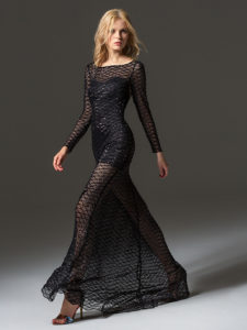 Style #350, long sleeve sequined evening gown features flower embroidery on the back and a full-length sheer skirt, available in black