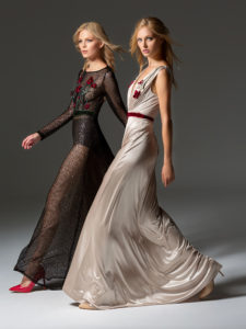 Style #354, long sleeve sequinned evening gown features flower 3D embroidery on the top, velvet belt, keyhole open back, and a full-length sheer skirt. Style #355, illusion plunging neckline evening gown with floral embroidered top and velvet belt. Styles are available in black, beige