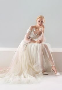 Style #18/1907L, bishop sleeve A-line wedding dress with floral lace embroidery and illusion back, available in ivory-pink