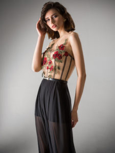 Style #410-8, Flowy jumpsuit with an illusion neckline, available in powder, ivory, black, red, berry