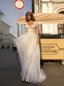 A bride in a whimsical tulle gown with a sweetheart neckline and lace bodice, exuding the sophistication of modern wedding dresses Toronto.